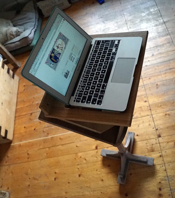 My laptop mounted on a lectern and book stand