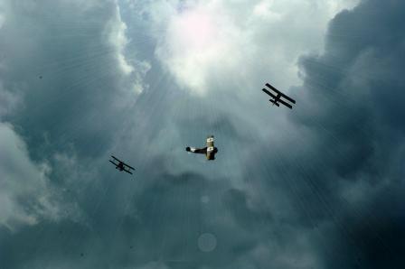 The WW1 aircraft flying in a dark and stormy sky.