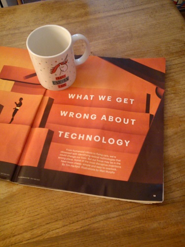 Photo of magazine article, with mug