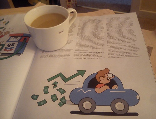 Photo of magazine article, with mug