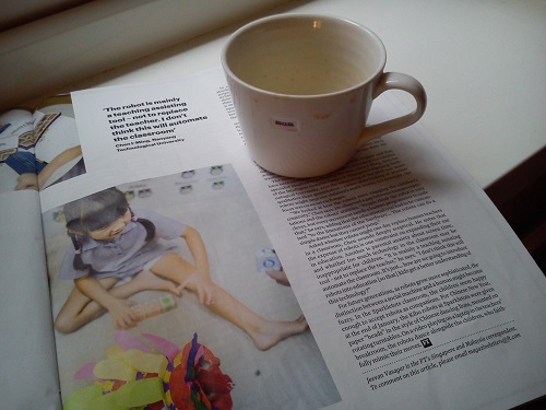 Photo of magazine article, with mug