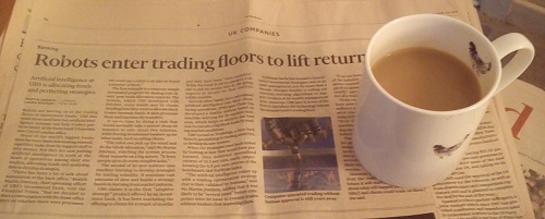 newspaper article with mug of tea