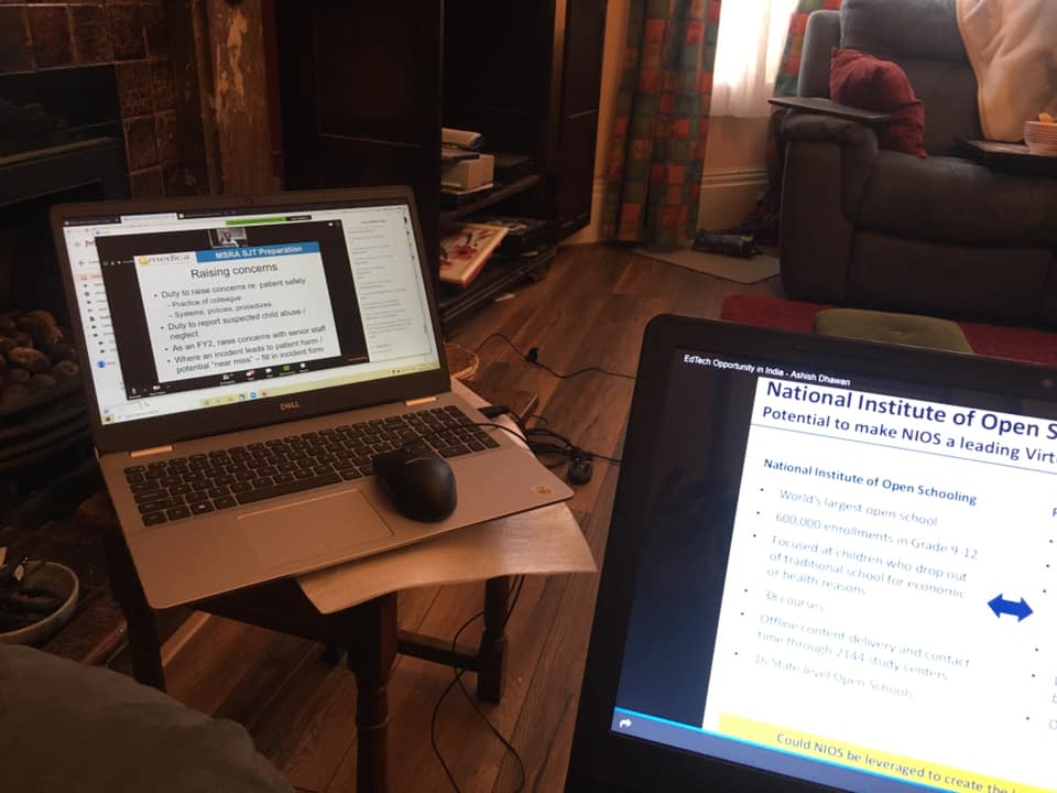 Two laptops, both in use