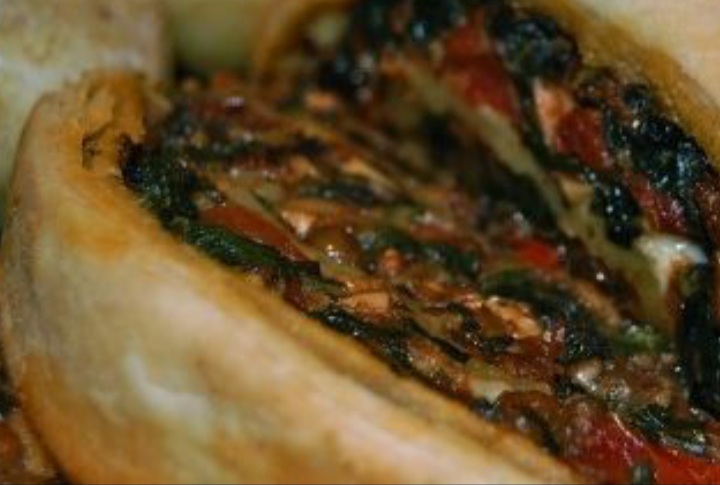 A mushroom roulade made with lentis, spinach and some vegetables.