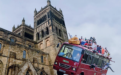 A montage of Durham Cathedral and a holiday bus out of control