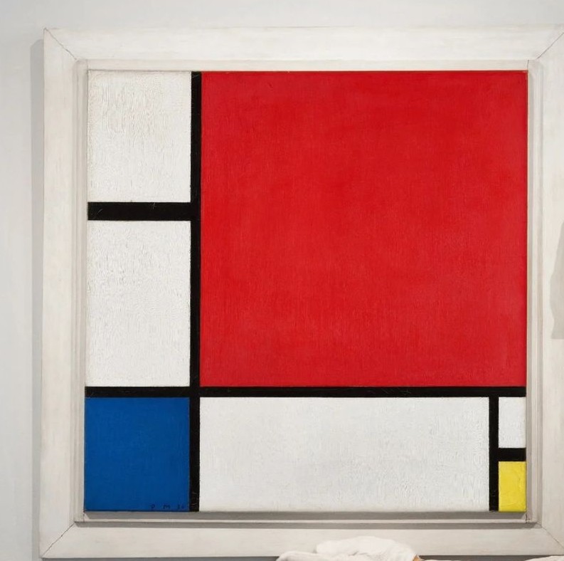 A large red square on the right divided by black lines and blue rectangle on left with a yellow and rectangle.