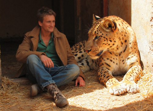 An AI-generated image of the author with a leopard