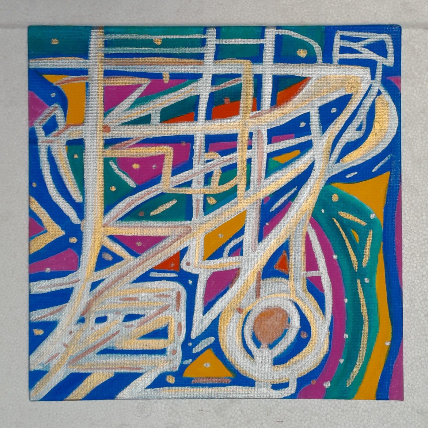 Abstract painting in blue, green, yellow, gold, violet, and silver. The criss crossing metallic lines make me think of an aerial view of a city.