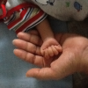 My youngest's hand in mine, Feb 2012