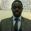 The picture indicated a grew suit with a tie and blue shirt.
