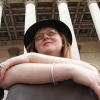 Sarah sitting on the steps outside the Fitzwilliam Museum in Cambridge